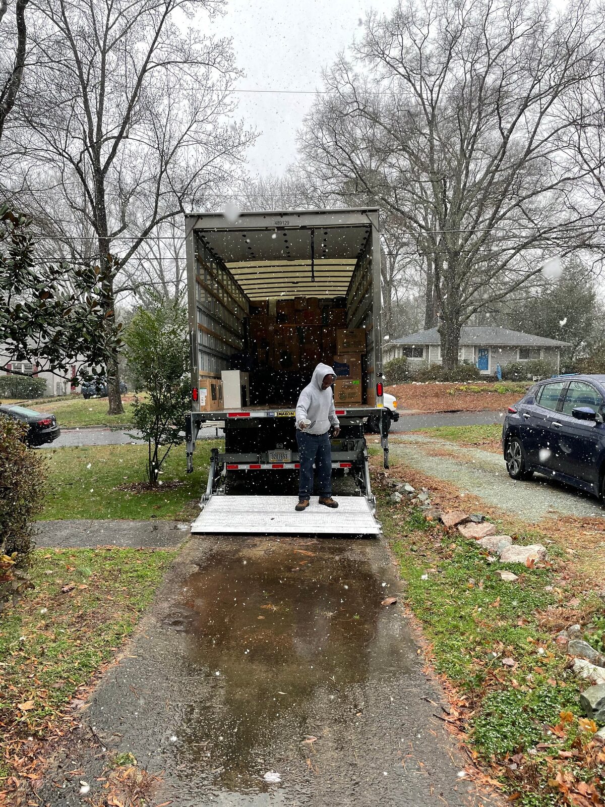 Royalty Moving box truck parked with the ramp down, ready to load